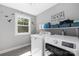 Functional laundry room with modern appliances, ample storage, and natural light at 3902 Mcgee Point Rd, Terrell, NC 28682