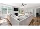 The cozy living room features ample natural light, fireplace and stylish furnishings at 3902 Mcgee Point Rd, Terrell, NC 28682