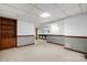 Partially finished basement with carpeted flooring, neutral walls, and a pool table in the background at 4007 Black Oak Rd, Hickory, NC 28602