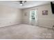 Cozy bedroom with neutral walls, soft carpet, ceiling fan and natural light at 4007 Black Oak Rd, Hickory, NC 28602
