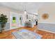 Dining space with hardwood floors and french doors leading to an outdoor area at 4007 Black Oak Rd, Hickory, NC 28602