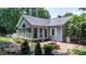 The back of the home features a brick patio, sunroom, fire pit, and fenced yard at 4007 Black Oak Rd, Hickory, NC 28602