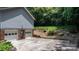 Drive-under garage with two bays and an additional storage closet or entrance behind the home at 4007 Black Oak Rd, Hickory, NC 28602