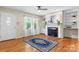 Inviting living room with hardwood floors, a decorative fireplace, and bright windows at 4007 Black Oak Rd, Hickory, NC 28602