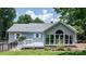 The back of the home features a sunroom with large windows and a deck at 4007 Black Oak Rd, Hickory, NC 28602