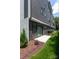 Townhome features a small patio space with a grassy backyard, perfect for outdoor entertaining at 4203 Walker Rd, Charlotte, NC 28211