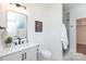 Well-lit bathroom with a sleek vanity, framed mirror, and glass-enclosed shower at 4203 Walker Rd, Charlotte, NC 28211