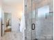Modern bathroom featuring a glass shower, stylish tile work, and a contemporary vanity at 4203 Walker Rd, Charlotte, NC 28211