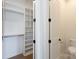Bright walk-in closet featuring custom shelving and ample storage space at 4203 Walker Rd, Charlotte, NC 28211