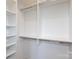 Walk-in closet with a configurable storage system with shelving at 4203 Walker Rd, Charlotte, NC 28211