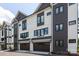 Modern townhouse exterior showing dark-trimmed windows and attached garages at 4203 Walker Rd, Charlotte, NC 28211