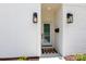 Modern front door with sleek lighting and 'hello' welcome mat at 4203 Walker Rd, Charlotte, NC 28211