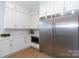 Gourmet kitchen with stainless steel appliances, white cabinets, and sleek countertops at 4203 Walker Rd, Charlotte, NC 28211