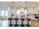 Bright kitchen featuring a spacious island with seating, pendant lighting, and modern finishes at 4203 Walker Rd, Charlotte, NC 28211