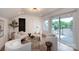 Spacious living room with white walls, plush seating, hardwood floors and balcony access at 4203 Walker Rd, Charlotte, NC 28211