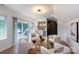 Stylish living room featuring a wet bar, balcony access, and ample seating for entertaining at 4203 Walker Rd, Charlotte, NC 28211