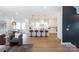 Bright open-concept living space featuring a modern kitchen, a dining area, and hardwood floors at 4203 Walker Rd, Charlotte, NC 28211