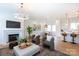 Cozy living area featuring a fireplace, modern light fixture and open floor plan at 4203 Walker Rd, Charlotte, NC 28211