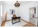 Bright office space with hardwood flooring, large window, decor lamp, contemporary desk and office chair at 4203 Walker Rd, Charlotte, NC 28211