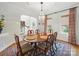Dining room with oval table, chandelier, decorative rug, and large windows that offer great natural light at 4644 Snow Dr, Harrisburg, NC 28075