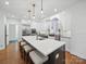 Bright, spacious kitchen features a large island, modern appliances, and pendant lighting at 4644 Snow Dr, Harrisburg, NC 28075