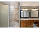 Bright bathroom with tile shower, built in bench and dual vanity at 4672 Snow Dr, Harrisburg, NC 28075