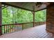 Enjoy the private wooded views from this home's spacious covered deck at 4672 Snow Dr, Harrisburg, NC 28075