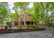 Beautiful brick home with a large deck and mature trees offering privacy at 4672 Snow Dr, Harrisburg, NC 28075