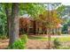 Traditional two-story brick home with mature landscaping and a manicured lawn at 4672 Snow Dr, Harrisburg, NC 28075