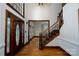 Elegant foyer features a grand staircase, hardwood floors, and a beautiful stained-glass door at 4672 Snow Dr, Harrisburg, NC 28075