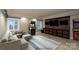 Finished basement game room with arcade games and comfortable seating at 4672 Snow Dr, Harrisburg, NC 28075