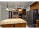 Spacious kitchen featuring a center island, stainless steel appliances, and custom wood cabinetry at 4672 Snow Dr, Harrisburg, NC 28075