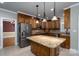Traditional kitchen featuring wood cabinets, granite countertops, and stainless steel appliances at 4672 Snow Dr, Harrisburg, NC 28075