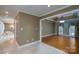 This Living Room flows to the en-suite bath and dining area at 4672 Snow Dr, Harrisburg, NC 28075