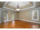 The living room has multiple windows with elegant drapery at 4672 Snow Dr, Harrisburg, NC 28075