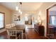 Bright dining area with hardwood floors and view to adjacent kitchen at 505 S Eastway Dr, Troutman, NC 28166