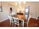 Cozy dining room features wood floors and easy access to kitchen at 505 S Eastway Dr, Troutman, NC 28166