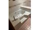 Bathroom with jacuzzi tub, tile surround, and chrome hardware at 506 Royal St # 9-12, East Spencer, NC 28144