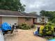 Ranch home with brick exterior, mature landscaping, and an attached one car garage at 506 Royal St # 9-12, East Spencer, NC 28144
