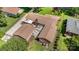Aerial view of the property featuring a large patio and mature trees at 5424 Doncaster Dr, Charlotte, NC 28211