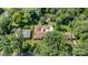 Estate aerial view shows the home nestled among mature trees and landscaping at 5424 Doncaster Dr, Charlotte, NC 28211