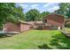 Spacious backyard with mature trees, patio, and privacy at 5424 Doncaster Dr, Charlotte, NC 28211