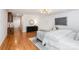 Bedroom featuring hardwood floors, modern art, and a neutral palette at 5424 Doncaster Dr, Charlotte, NC 28211