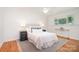 Bright bedroom features hardwood floors, ceiling fan, and ample natural light at 5424 Doncaster Dr, Charlotte, NC 28211