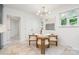 Dining area featuring a round table, and modern lighting next to a doorway at 5424 Doncaster Dr, Charlotte, NC 28211