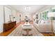 Sun-filled living room featuring hardwood floors, a neutral color palette, and stylish furnishings at 5424 Doncaster Dr, Charlotte, NC 28211