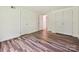 A bright bedroom with wood floors and two large closets at 5811 Rock Hollow Dr, Charlotte, NC 28212