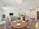 Cozy dining area connecting to a comfortable living space, perfect for entertaining at 5811 Rock Hollow Dr, Charlotte, NC 28212