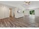Spacious living and kitchen area with hardwood floors and bright lighting at 5811 Rock Hollow Dr, Charlotte, NC 28212