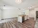 Open-concept living space featuring hardwood floors and ample natural light at 5811 Rock Hollow Dr, Charlotte, NC 28212